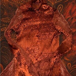 rich burnt orange avant-garde long-sleeve top